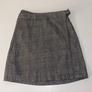 Brand Melville plaid wrap skirt. Adjustable with 3 buttons and belt like clip
